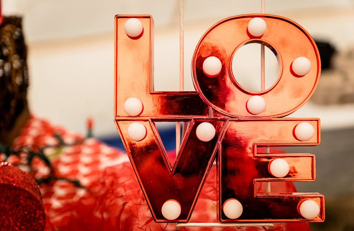 Minimalist valentine decor for home using neutral tones and a single red accent